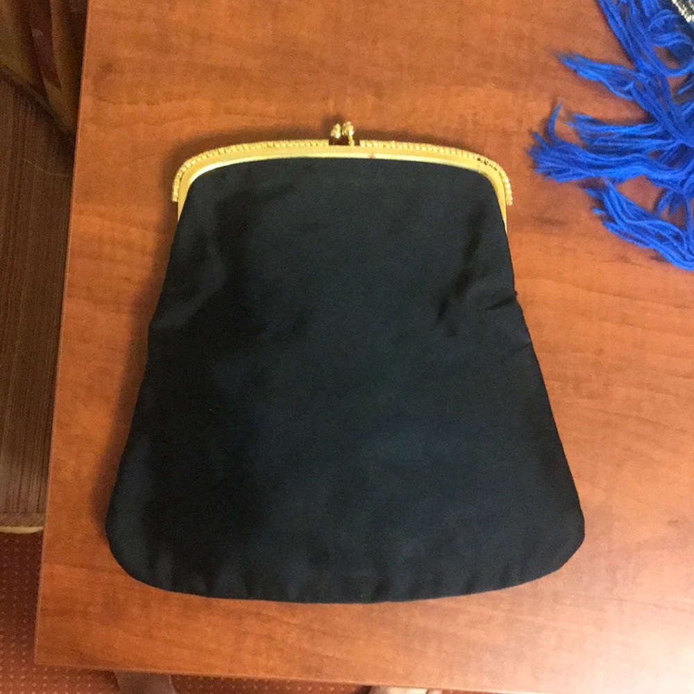 Vintage evening purse. Black with cream interior. Jewel studded top.